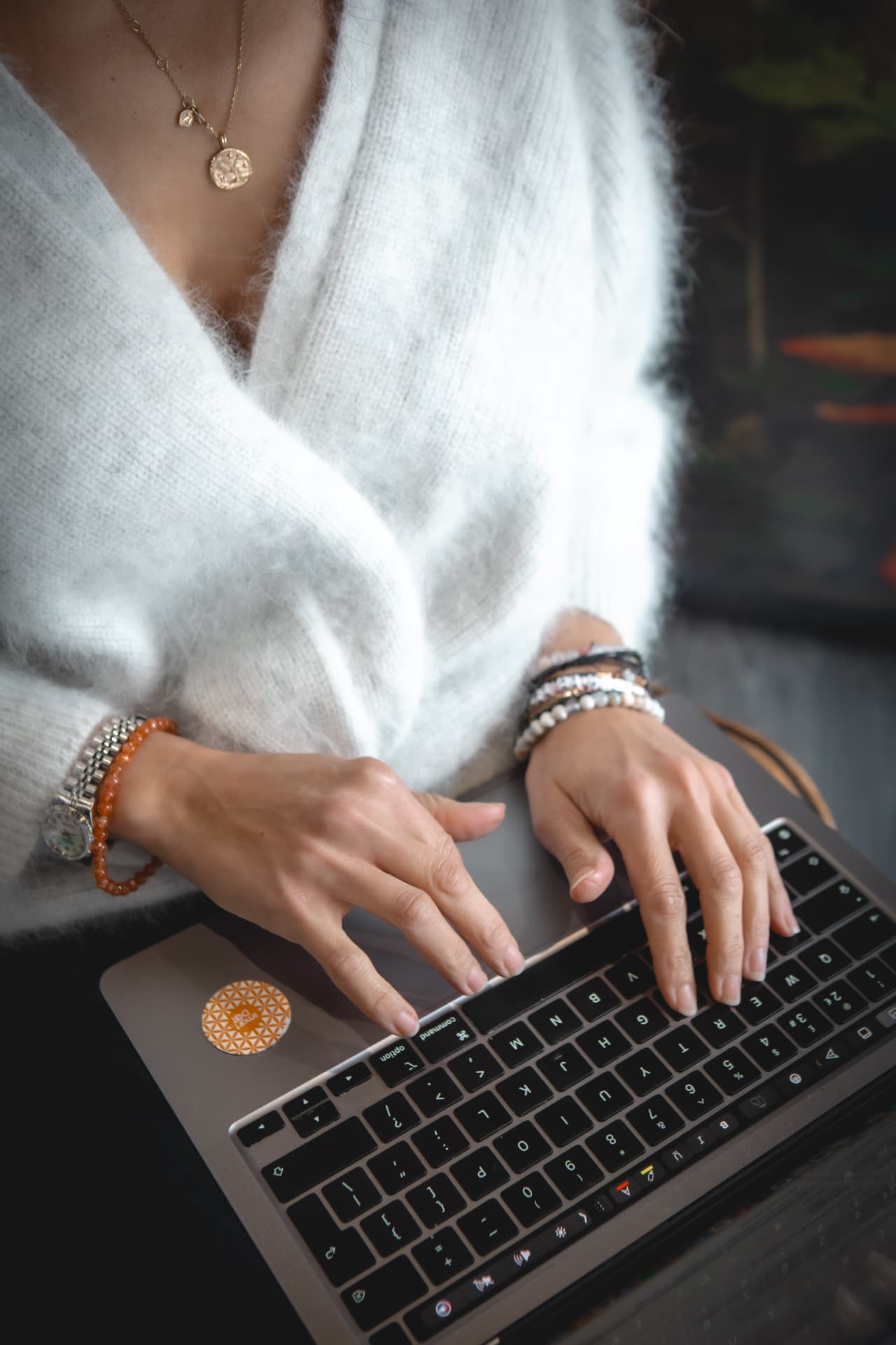 Close-up of Naomi Buff typing on a laptop